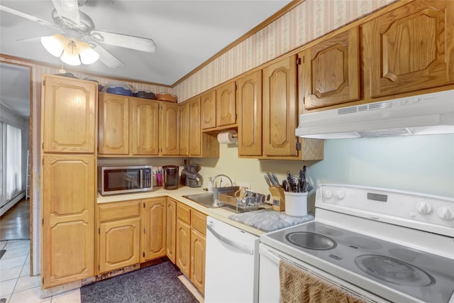 kitchen with white appliances, under cabinet range hood, light countertops, ceiling fan, and light tile patterned flooring