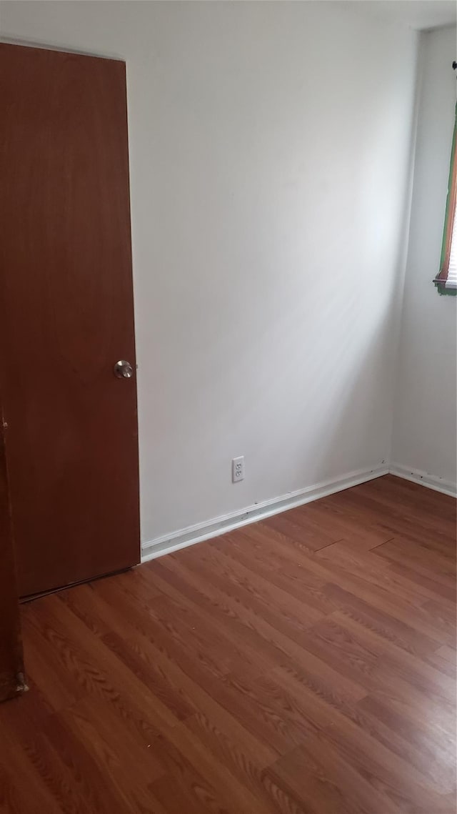 2261 Story Ave, Bronx, NY 10473 - spare room featuring wood finished floors and baseboards