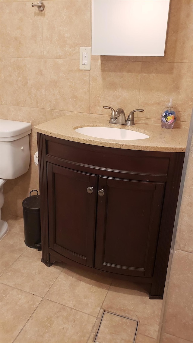 2261 Story Ave, Bronx, NY 10473 - bathroom with vanity, tile walls, tasteful backsplash, and tile patterned floors