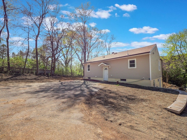 rear view of property with fence