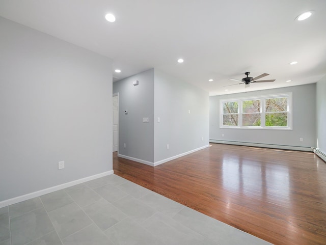 empty room with recessed lighting, ceiling fan, and a baseboard heating unit