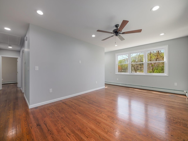 empty room with recessed lighting, attic access, ceiling fan, and wood finished floors