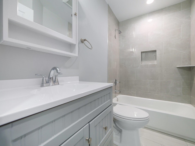 bathroom with toilet, shower / washtub combination, and vanity