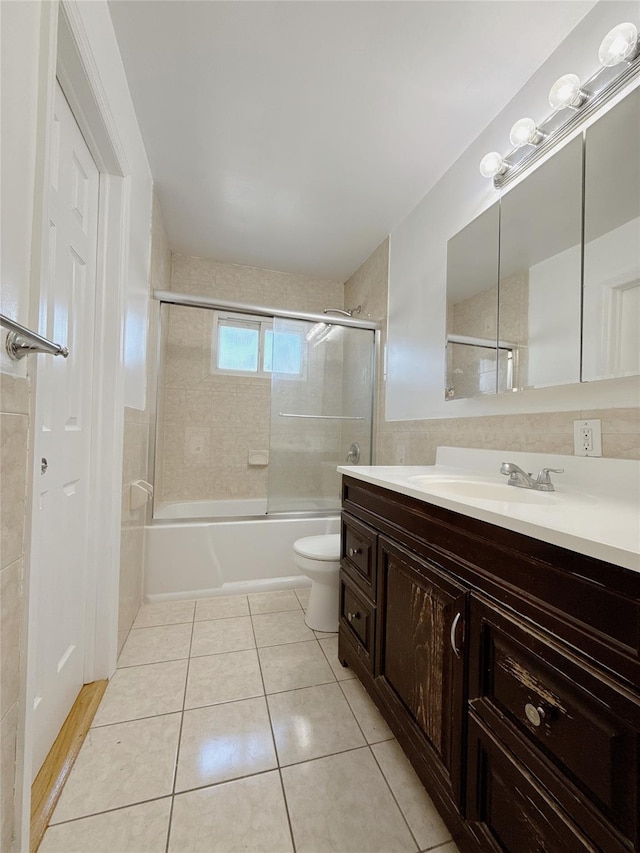 full bath with enclosed tub / shower combo, toilet, tile patterned flooring, and vanity