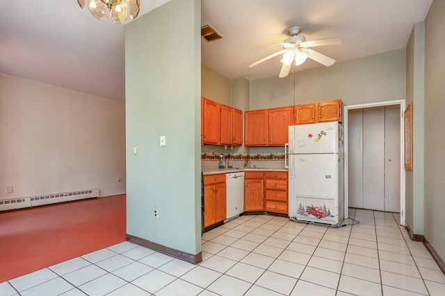 kitchen featuring visible vents, baseboard heating, light countertops, ceiling fan with notable chandelier, and white appliances