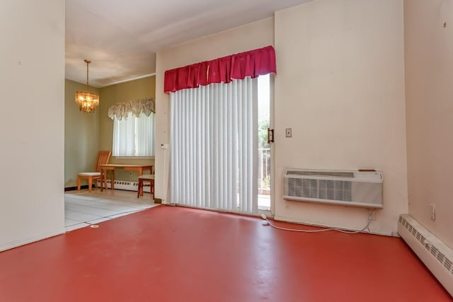 unfurnished room with a chandelier, baseboard heating, and a wealth of natural light