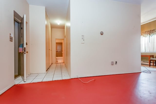 empty room featuring a baseboard radiator