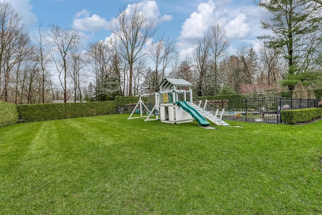 view of play area featuring a yard and fence