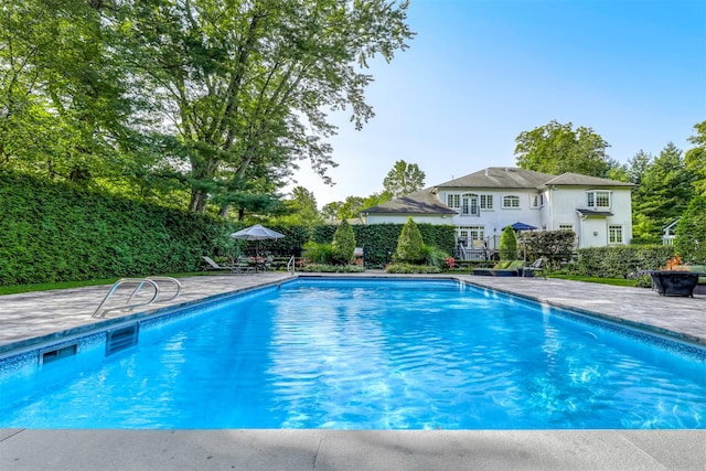view of pool featuring a patio and a fenced in pool
