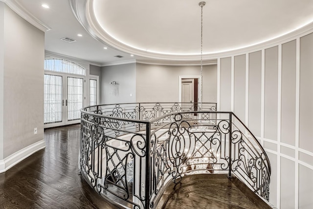 interior space with recessed lighting, wood finished floors, ornamental molding, visible vents, and french doors