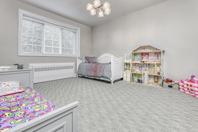 bedroom with carpet flooring, radiator heating unit, and a chandelier