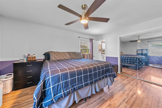bedroom featuring a closet, a ceiling fan, and wood finished floors