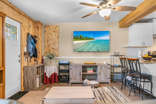 interior space with wood finished floors and ceiling fan