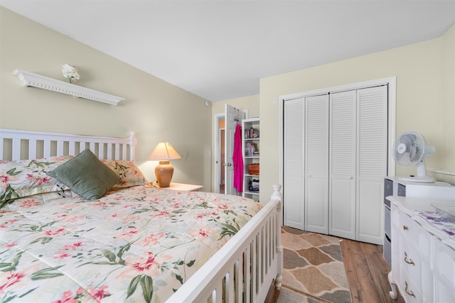 bedroom featuring a closet and wood finished floors