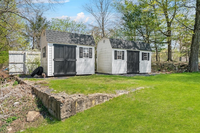 view of shed with fence