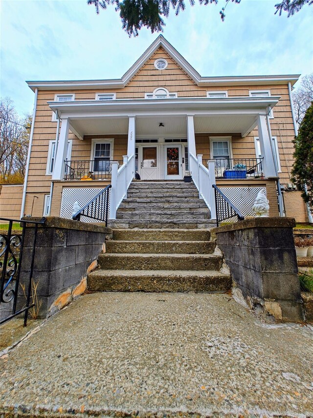 635 N Division St, Peekskill, NY 10566 - view of front of property with stairway and a porch