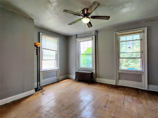 635 N Division St, Peekskill, NY 10566 - spare room featuring hardwood / wood-style floors, baseboards, and radiator