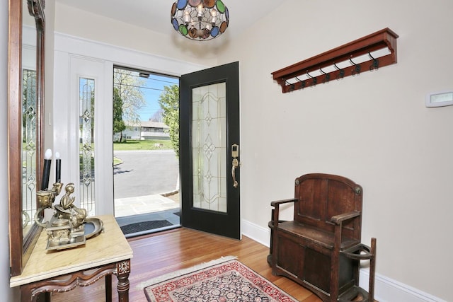 85 S Harrison Ave, Congers, NY 10920 - entrance foyer with baseboards, wood finished floors, and a chandelier