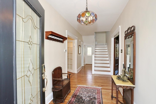 85 S Harrison Ave, Congers, NY 10920 - foyer featuring an inviting chandelier, baseboards, stairs, and wood finished floors