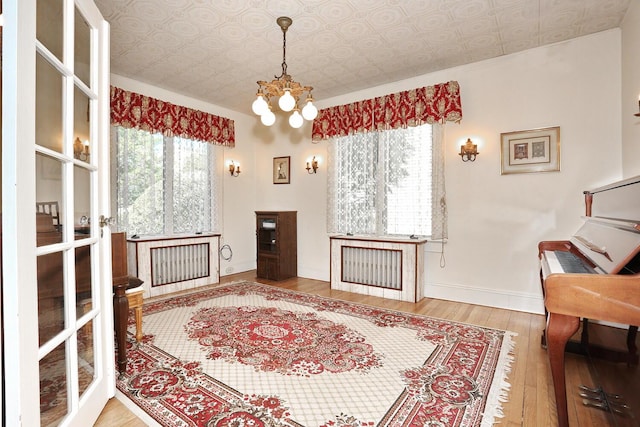 85 S Harrison Ave, Congers, NY 10920 - living area with an ornate ceiling, baseboards, a chandelier, and hardwood / wood-style floors