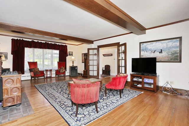 85 S Harrison Ave, Congers, NY 10920 - living room with baseboard heating, ornamental molding, beamed ceiling, and wood finished floors