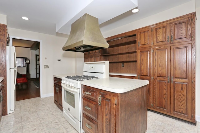 85 S Harrison Ave, Congers, NY 10920 - kitchen with island exhaust hood, open shelves, light countertops, recessed lighting, and white appliances