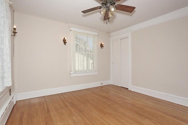 85 S Harrison Ave, Congers, NY 10920 - spare room featuring baseboards, ceiling fan, baseboard heating, and wood finished floors