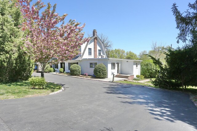 85 S Harrison Ave, Congers, NY 10920 - view of front facade with a chimney and stucco siding