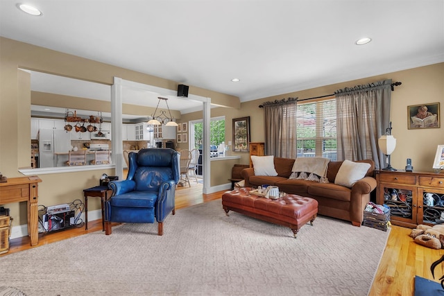 living area featuring recessed lighting and wood finished floors