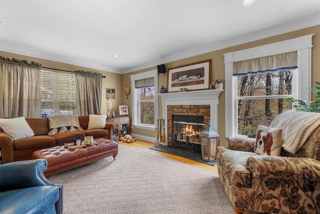 living room with plenty of natural light, a fireplace, recessed lighting, and wood finished floors