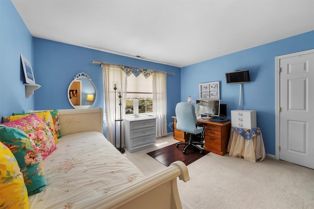 bedroom featuring carpet floors, baseboards, and visible vents
