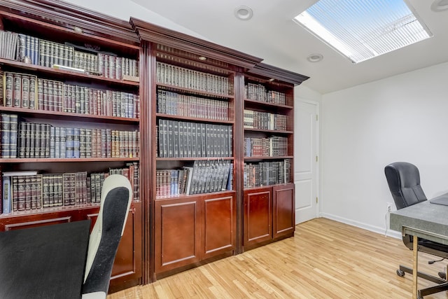 office space with wood finished floors and baseboards