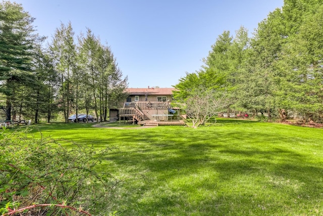 view of yard featuring a deck