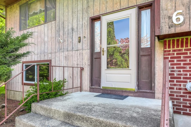 property entrance with brick siding