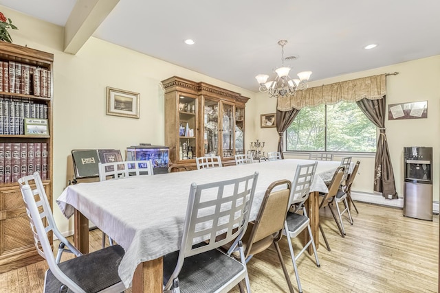 dining space featuring baseboards, light wood-type flooring, a notable chandelier, and recessed lighting