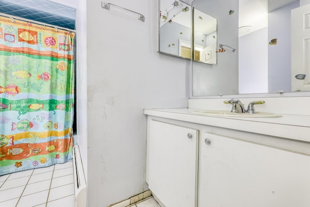 bathroom with curtained shower, tile patterned flooring, and vanity