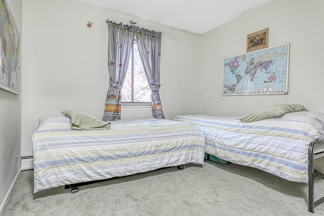 bedroom featuring carpet and a baseboard radiator
