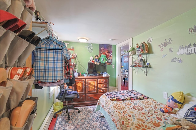 bedroom with wood finished floors