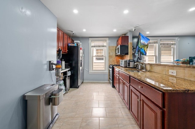 26-18 92nd St, East Elmhurst, NY 11369 - kitchen featuring stainless steel appliances, a sink, plenty of natural light, dark brown cabinets, and recessed lighting