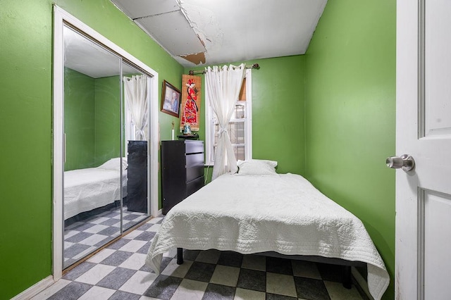 26-18 92nd St, East Elmhurst, NY 11369 - bedroom with tile patterned floors and a closet