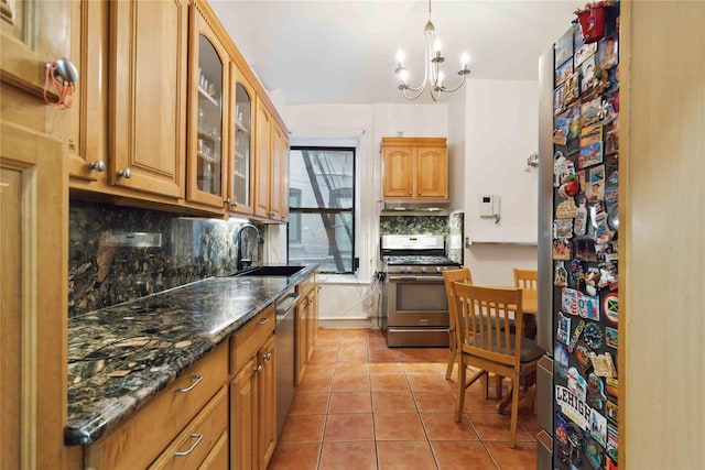 243 W 98th St Unit 2C, New York Manhattan, NY 10025 - kitchen featuring an inviting chandelier, tasteful backsplash, a sink, glass insert cabinets, and stainless steel appliances