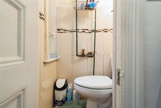 243 W 98th St Unit 2C, New York Manhattan, NY 10025 - half bathroom featuring toilet and tile walls