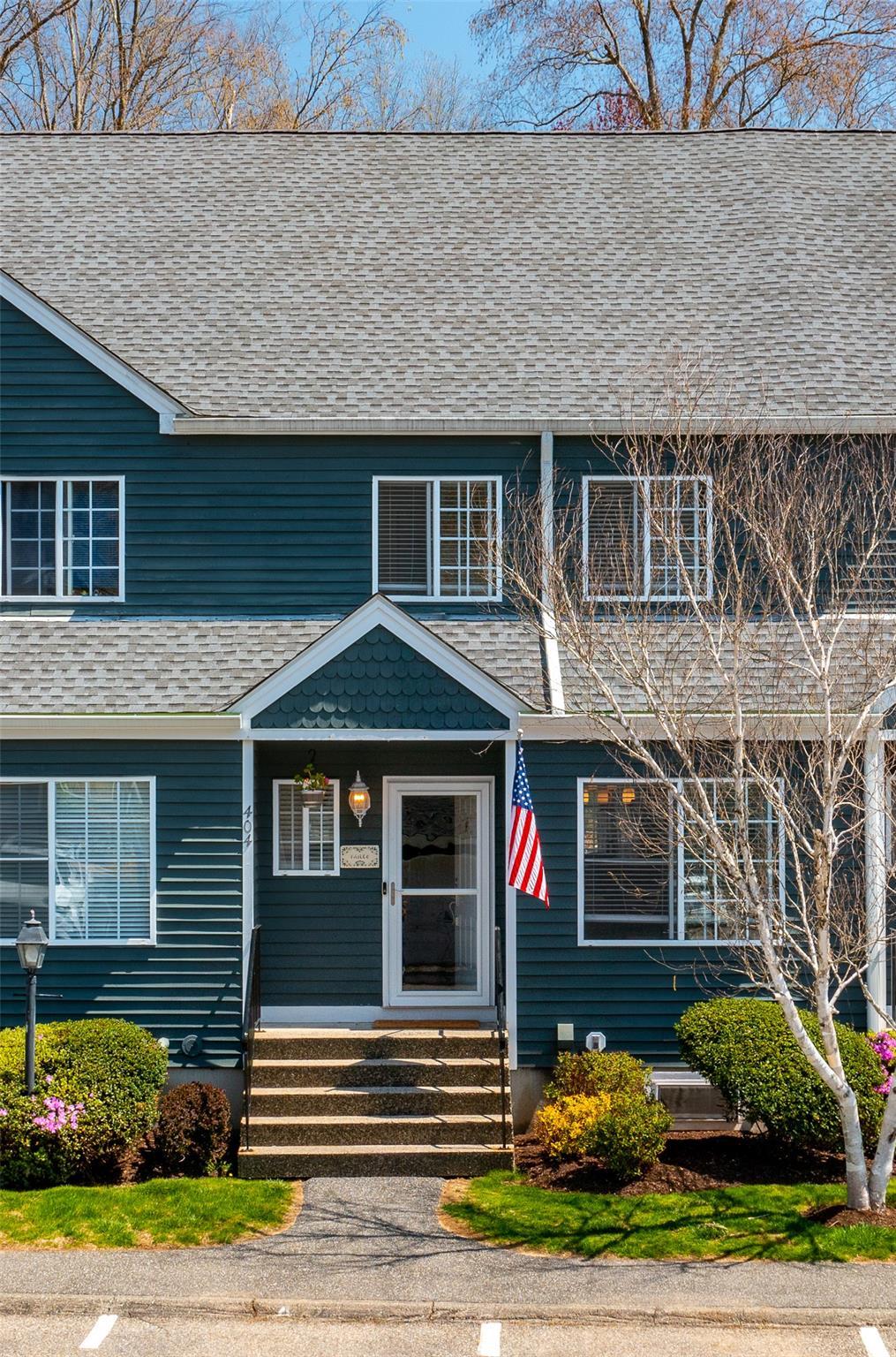 404 Kensington Ct, Brewster, NY 10509 - view of front facade with roof with shingles, a balcony, and entry steps