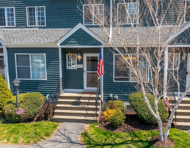 view of front of home featuring a shingled roof
