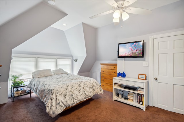 bedroom featuring lofted ceiling, multiple windows, and carpet