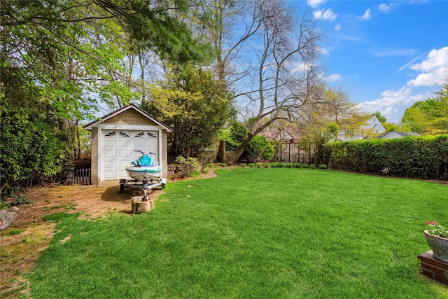 view of yard with fence and an outdoor structure