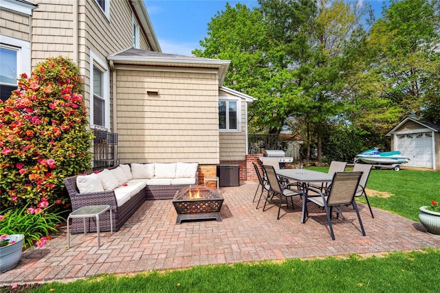 view of patio featuring outdoor dining area and an outdoor living space with a fire pit