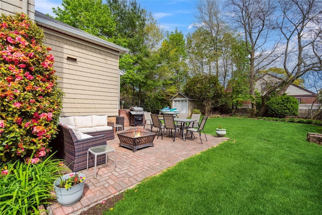 exterior space with fence, an outdoor living space with a fire pit, outdoor dining space, and grilling area