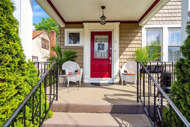 view of exterior entry featuring a porch