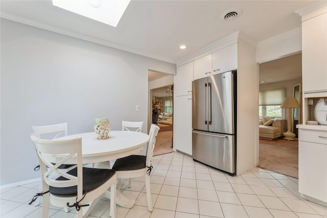 28 Verona Ct, New City, NY 10956 - kitchen with crown molding, visible vents, white cabinets, high end refrigerator, and a skylight